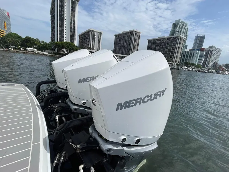 Slide: The Image of 2023 Formula 330 Crossover Bowrider OB with Mercury outboard engines on urban waterfront. - 46