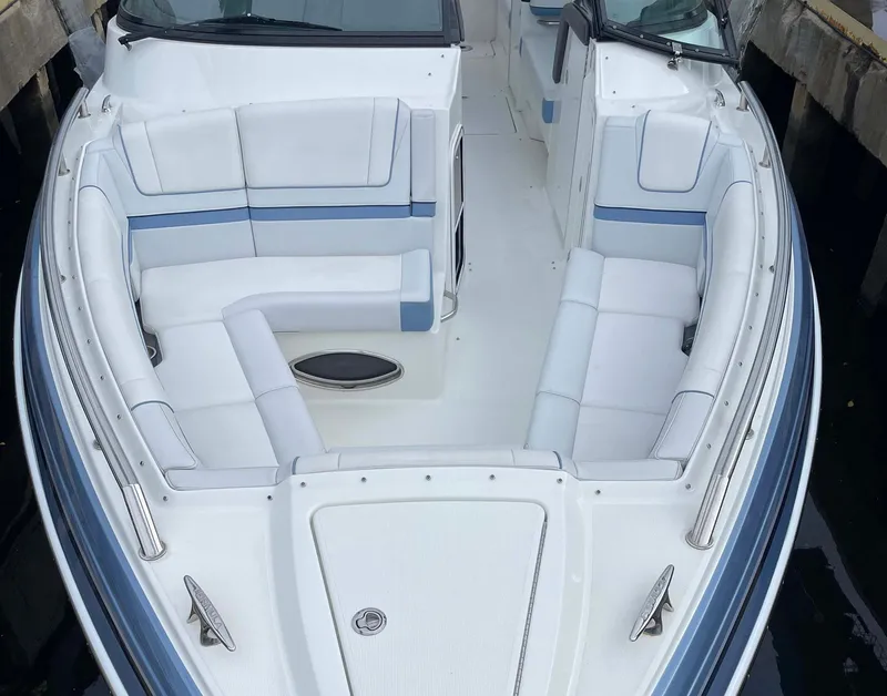 Slide: The Image of 2023 Formula 330 Crossover Bowrider OB with spacious seating and sleek design. - 8