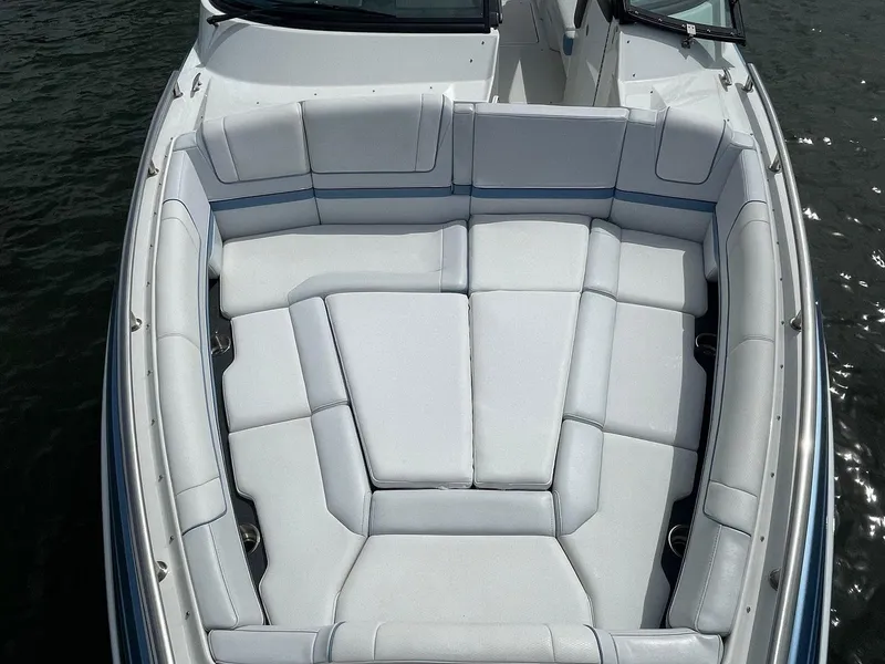 Slide: The Image of 2023 Formula 330 Crossover Bowrider OB with spacious seating on water. - 9