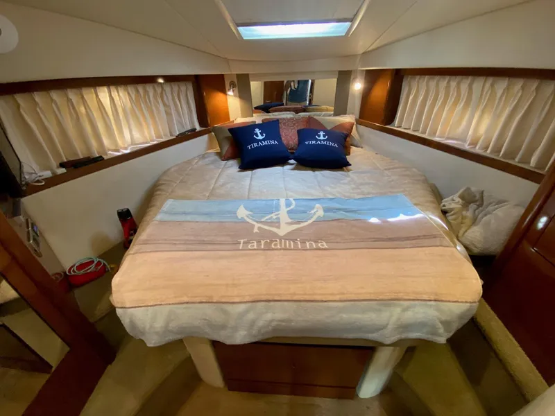 Slide: The Image of Luxurious cabin interior of 2008 Sea Ray 38 Sundancer with cozy bedding and nautical decor. - 11