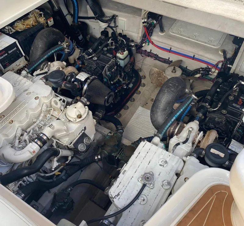 Slide: The Image of Engine compartment of a 2008 Sea Ray 38 Sundancer boat, showcasing dual engines. - 16