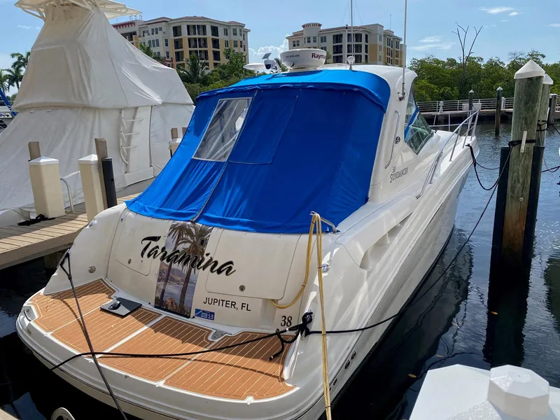 Slide: The Image of 2008 Sea Ray 38 Sundancer docked with blue cover in marina. - 4