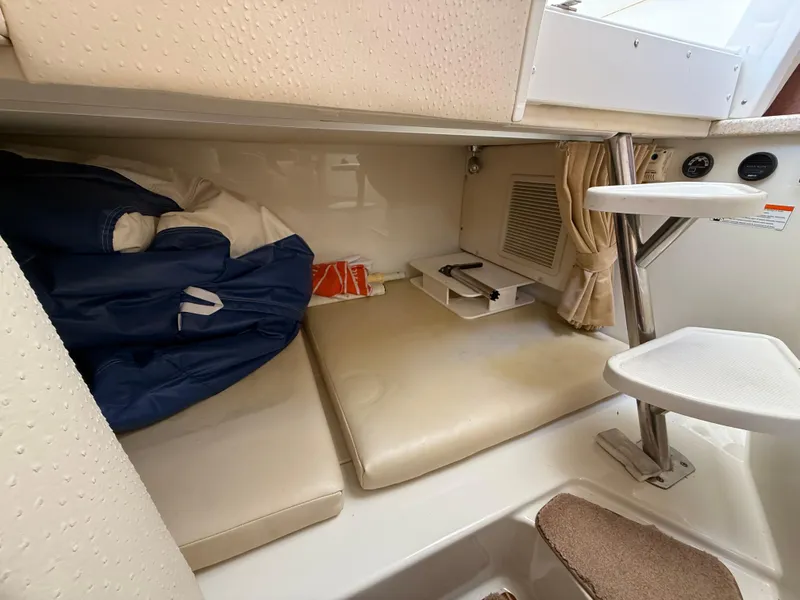 Slide: The Image of 2008 Hydra-Sports Vector 3500 VX cabin interior with cushions and storage space. - 10