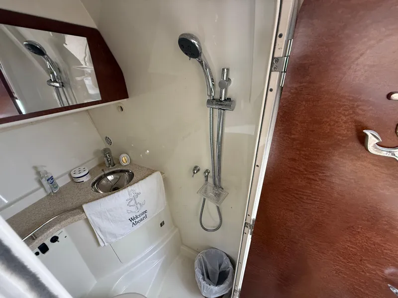 Slide: The Image of 2008 Hydra-Sports Vector 3500 VX bathroom with shower, sink, and mirror. - 12