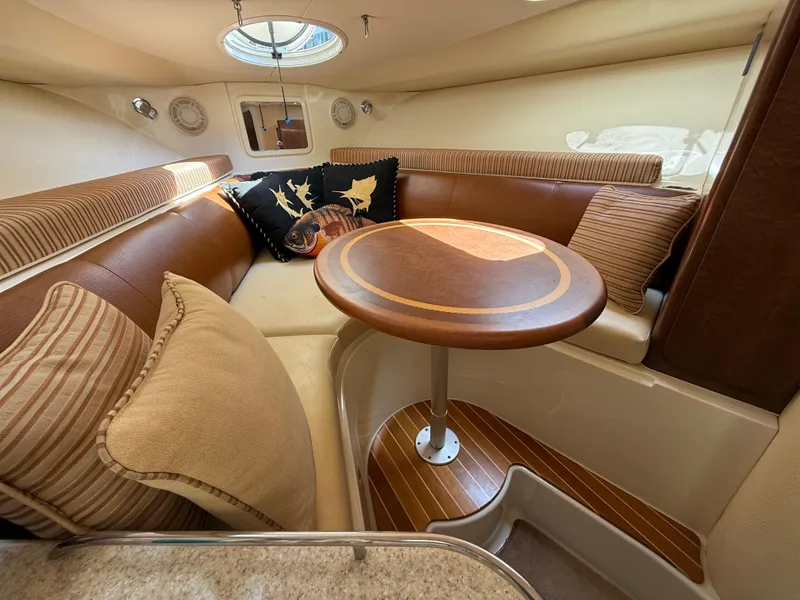 Slide: The Image of 2008 Hydra-Sports Vector 3500 VX cabin with cozy seating and elegant wooden table. - 13