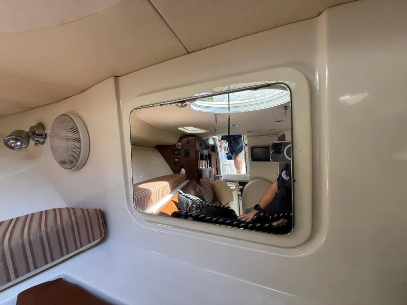 Slide: The Image of Interior of 2008 Hydra-Sports Vector 3500 VX boat cabin with seating and window reflection. - 15