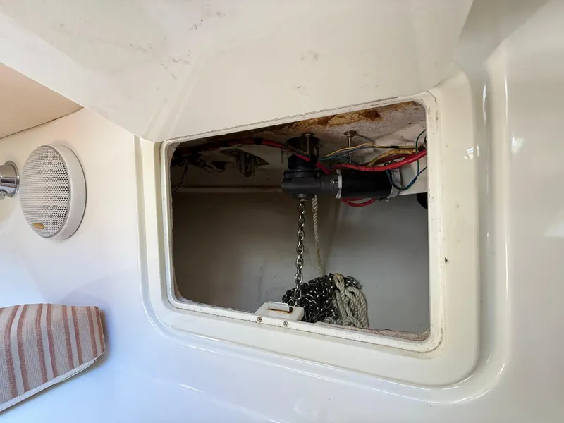 Slide: The Image of 2008 Hydra-Sports Vector 3500 VX anchor locker with chain and wiring visible. - 16