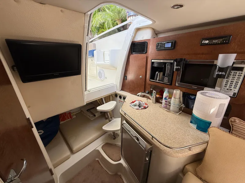 Slide: The Image of 2008 Hydra-Sports Vector 3500 VX cabin interior with kitchenette, seating, and entertainment system. - 17