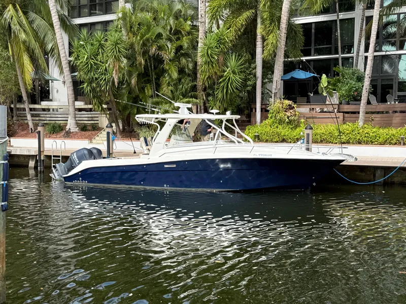 Slide: The Image of 2008 Hydra-Sports Vector 3500 VX boat docked by tropical foliage. - 2