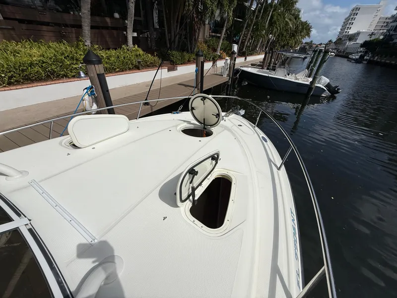 Slide: The Image of 2008 Hydra-Sports Vector 3500 VX boat docked in a scenic marina setting. - 21