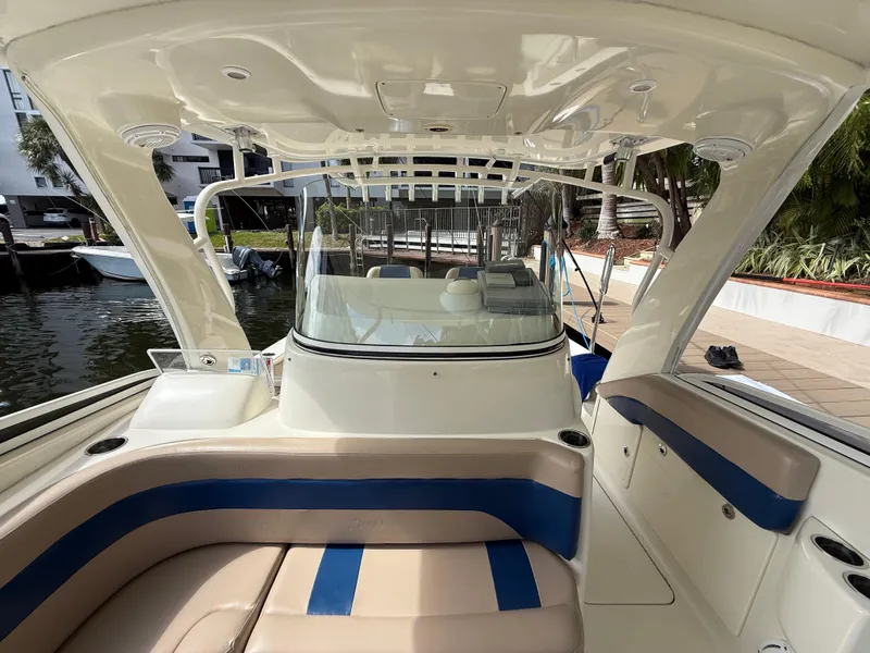 Slide: The Image of 2008 Hydra-Sports Vector 3500 VX boat interior with seating and helm, docked by the water. - 26