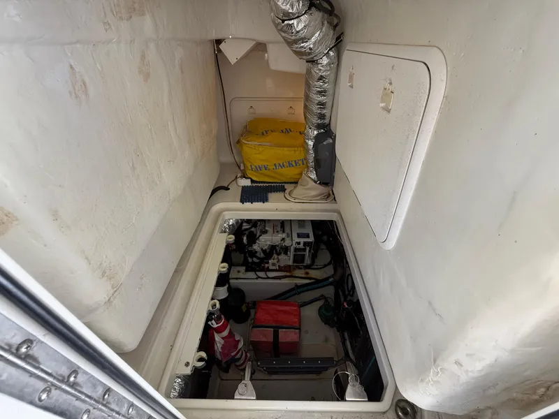 Slide: The Image of 2008 Hydra-Sports Vector 3500 VX engine compartment with visible equipment and storage. - 29