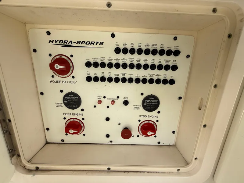 Slide: The Image of Control panel of 2008 Hydra-Sports Vector 3500 VX boat, featuring battery and engine switches. - 34