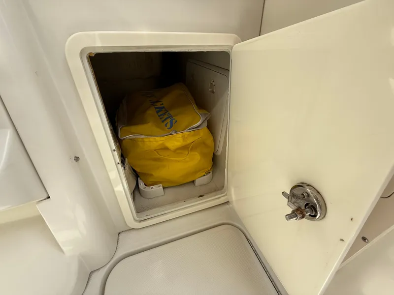 Slide: The Image of Storage compartment on 2008 Hydra-Sports Vector 3500 VX with yellow bag inside. - 40