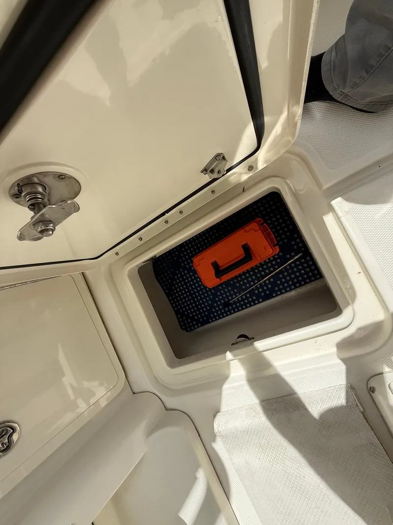 Slide: The Image of 2008 Hydra-Sports Vector 3500 VX storage compartment with orange case inside. - 41