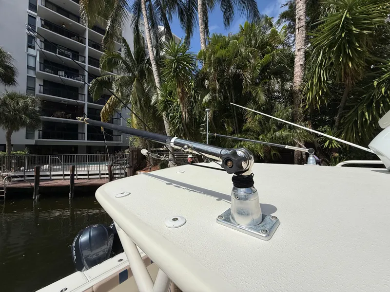 Slide: The Image of 2008 Hydra-Sports Vector 3500 VX boat with fishing rod holder, surrounded by tropical trees. - 44