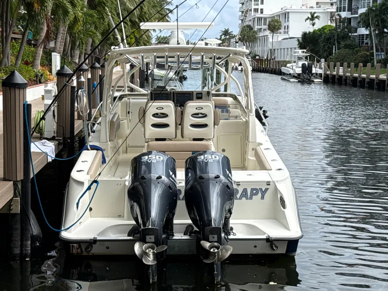 Slide: The Image of 2008 Hydra-Sports Vector 3500 VX boat docked with dual engines in a canal setting. - 6