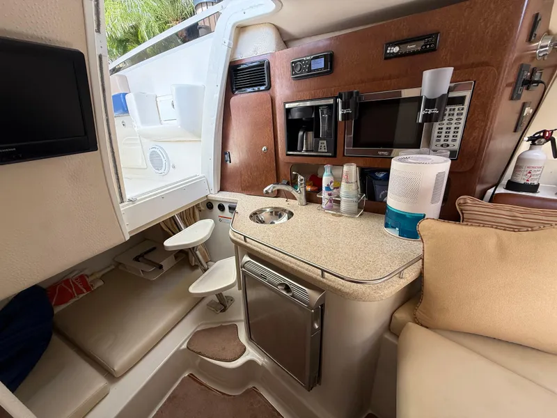 Slide: The Image of 2008 Hydra-Sports Vector 3500 VX cabin interior with kitchenette and seating area. - 8