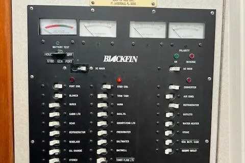 Slide: The Image of Electrical panel of 1997 Blackfin 30.7 EXPRESS boat with various switches and gauges. - 10