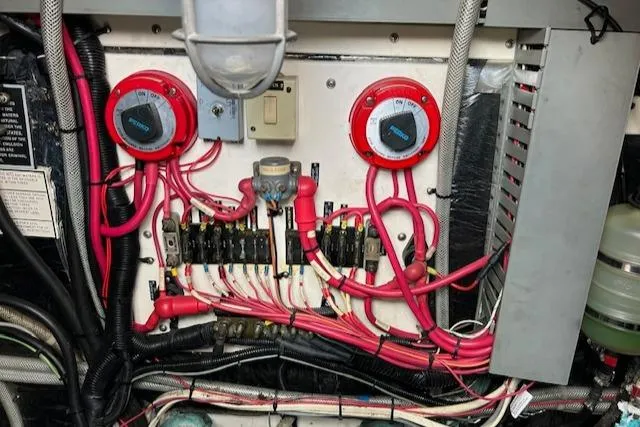 Slide: The Image of Electrical panel with red wiring in a 1997 Blackfin 30.7 EXPRESS boat. - 19
