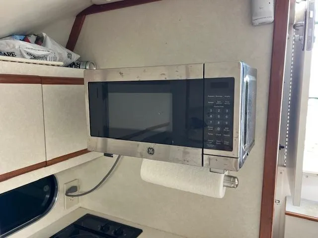 Slide: The Image of Microwave in 1997 Blackfin 30.7 EXPRESS boat kitchen interior. - 20