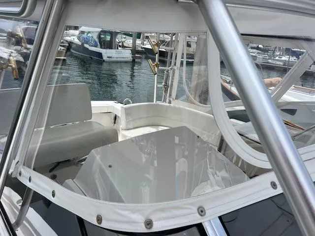 Slide: The Image of 1997 Blackfin 30.7 EXPRESS boat interior with marina view in the background. - 23