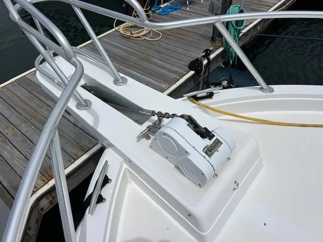 Slide: The Image of Bow of 1997 Blackfin 30.7 EXPRESS with anchor winch at dock. - 24