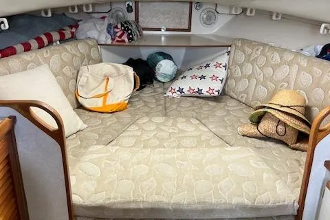 Slide: The Image of Cozy cabin interior of 1997 Blackfin 30.7 EXPRESS with cushions and personal items. - 27