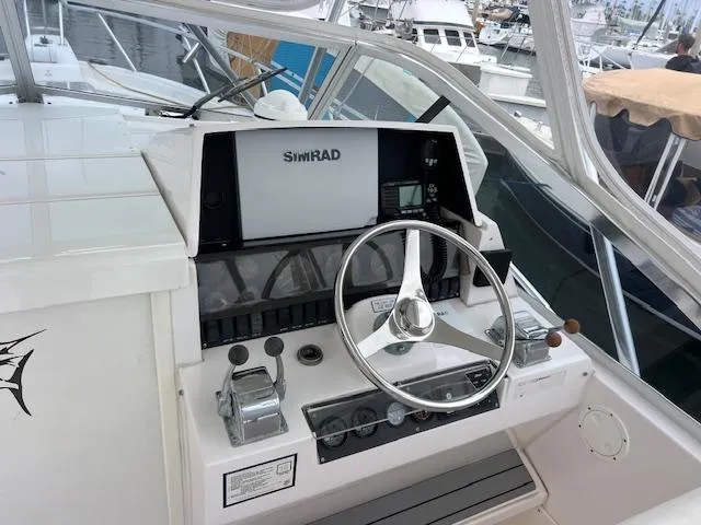 Slide: The Image of Control panel of a 1997 Blackfin 30.7 EXPRESS boat with Simrad navigation system. - 4