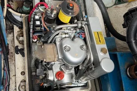 Slide: The Image of Engine compartment of a 1997 Blackfin 30.7 EXPRESS boat, showcasing mechanical components. - 8