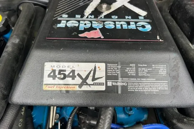 Slide: The Image of Engine cover of a Crusader 454 XL Series with fuel injection, Blackfin 30.7 EXPRESS, 1997. - 9