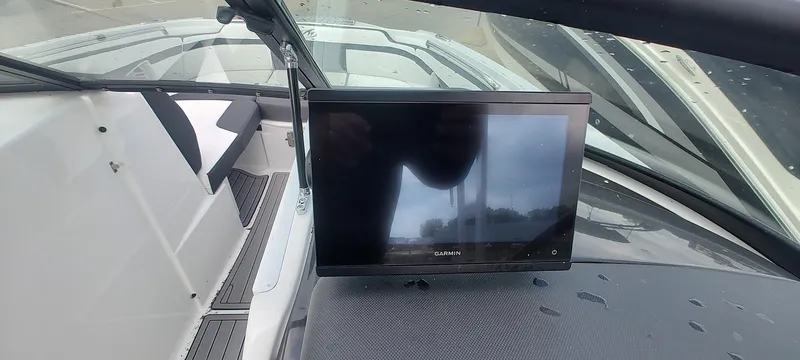 Slide: The Image of Dashboard of a 2021 Monterey M4 boat featuring a Garmin display screen. - 18