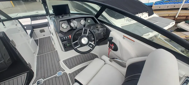 Slide: The Image of 2021 Monterey M4 boat interior with modern dashboard and steering wheel. - 9