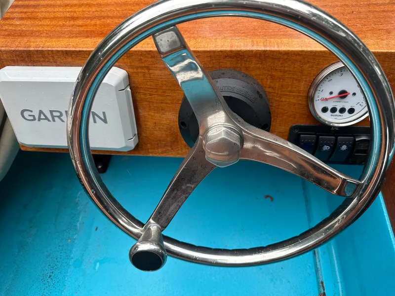 Slide: The Image of Steering wheel of a 1968 Boston Whaler 13 Sport boat with Garmin device. - 5