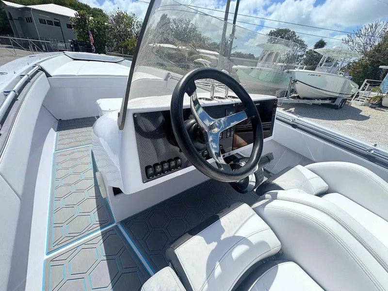 Slide: The Image of 2022 Phantom 32 CC boat interior with modern steering and seating. - 10