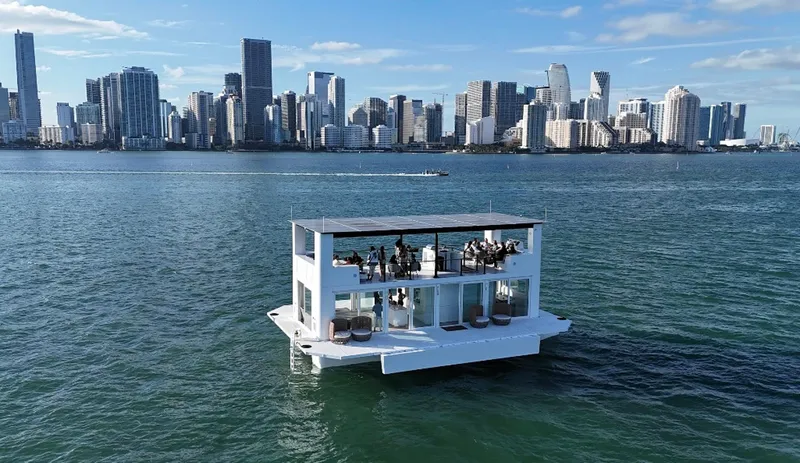 Slide: The Image of Floating modern Arkup 50 houseboat on water with city skyline in background, 2025 model. - 20