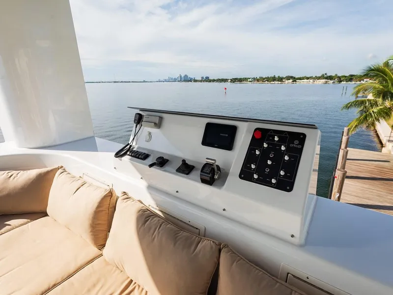 Slide: The Image of Control panel on luxury Arkup 50 yacht, overlooking serene waterfront view. - 4