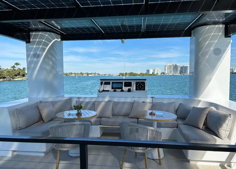 Slide: The Image of Luxurious seating area on Arkup 50 houseboat with waterfront view, 2025 model. - 5