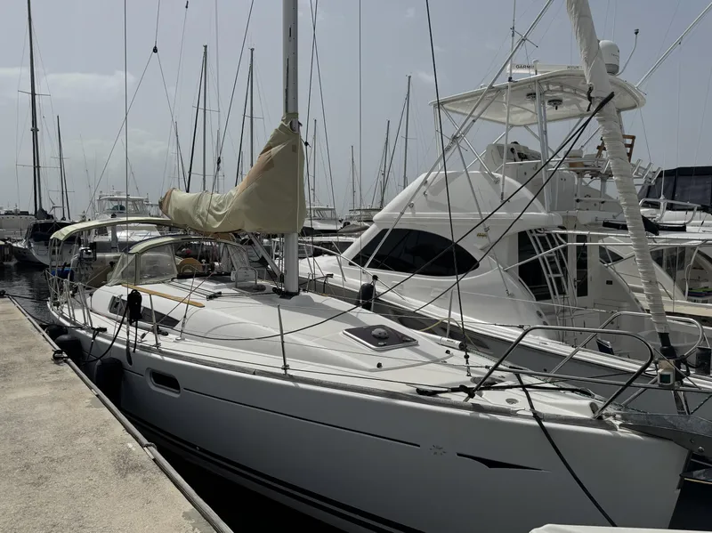 Slide: The Image of 2010 Jeanneau Sun Odyssey 39i Performance sailboat docked at marina. - 1