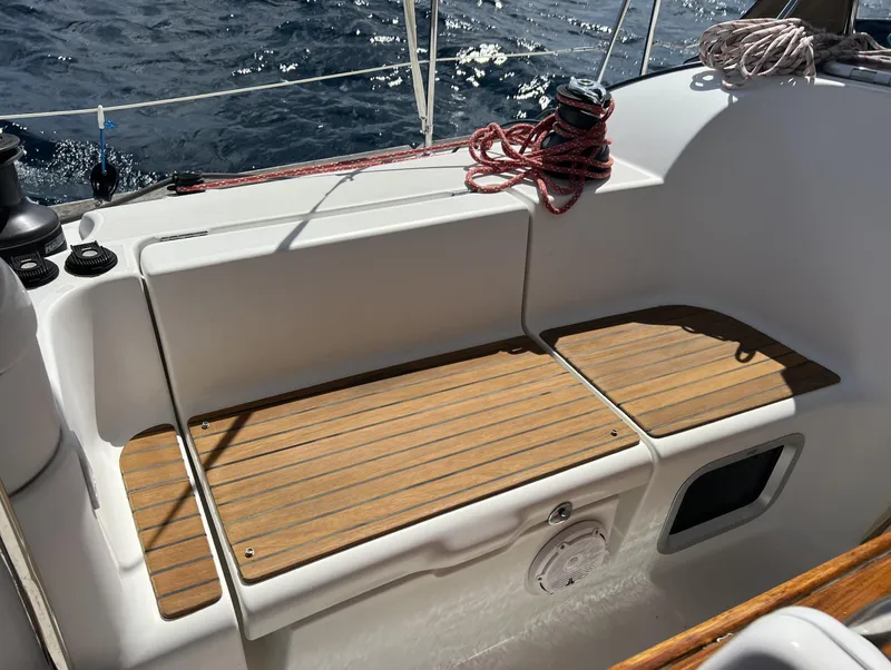 Slide: The Image of Cockpit of 2010 Jeanneau Sun Odyssey 39i Performance sailboat with teak seating and ocean view. - 13