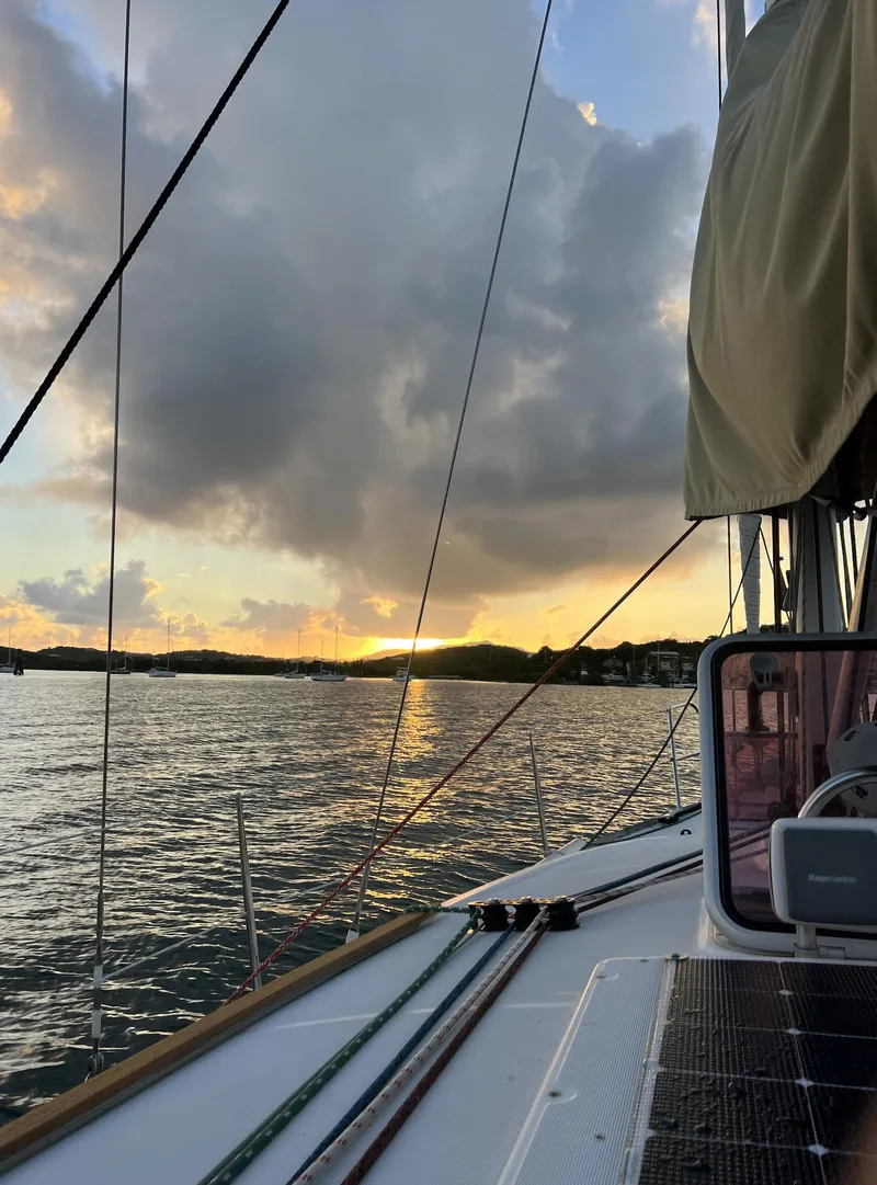 Slide: The Image of Jeanneau Sun Odyssey 39i sailing at sunset, 2010 model, with dramatic clouds and calm waters. - 16
