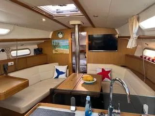 Slide: The Image of Interior of 2010 Jeanneau Sun Odyssey 39i Performance yacht with cozy seating and modern amenities. - 18