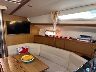 Slide: The Image of Interior of 2010 Jeanneau Sun Odyssey 39i Performance yacht with cozy seating and modern amenities. - 26