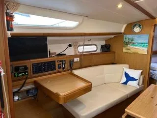 Slide: The Image of Interior of 2010 Jeanneau Sun Odyssey 39i Performance yacht with cozy seating and navigation equipment. - 28
