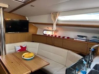 Slide: The Image of Interior of 2010 Jeanneau Sun Odyssey 39i Performance yacht with cozy seating and modern amenities. - 30