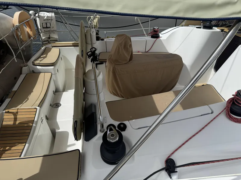 Slide: The Image of 2010 Jeanneau Sun Odyssey 39i Performance sailboat cockpit with beige seating and covered helm. - 6