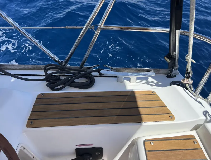 Slide: The Image of Cockpit of 2010 Jeanneau Sun Odyssey 39i Performance sailboat with teak seating and ocean view. - 8