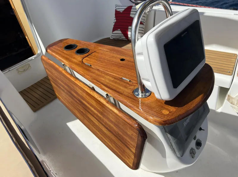 Slide: The Image of Cockpit of 2010 Jeanneau Sun Odyssey 39i Performance with wooden helm and navigation display. - 9