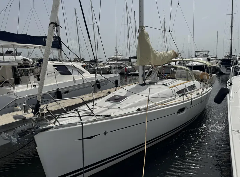 The Image of 2010 Jeanneau Sun Odyssey 39i Performance sailboat docked in a marina. - 0