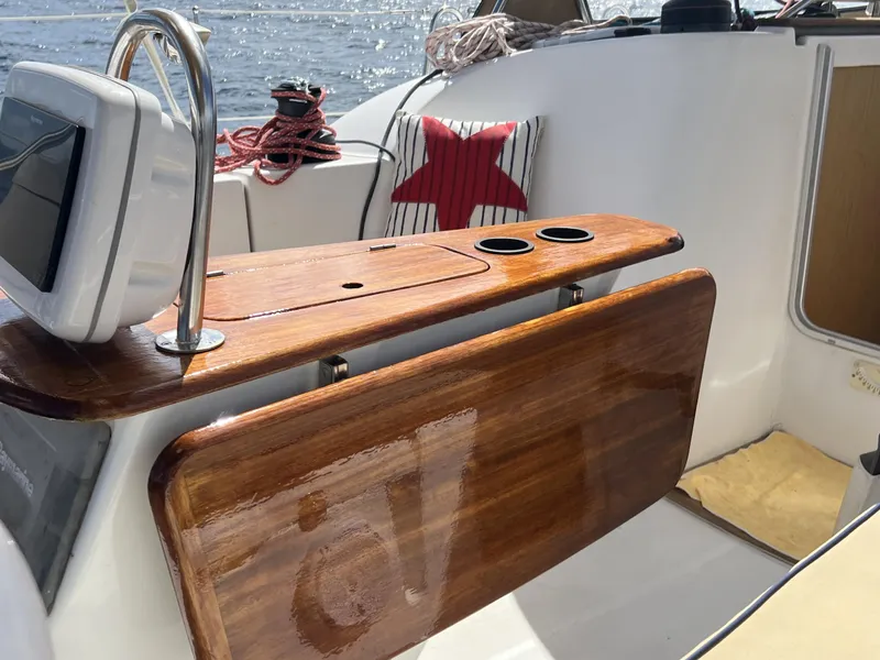 Slide: The Image of Cockpit of 2010 Jeanneau Sun Odyssey 39i Performance with wooden table and nautical decor. - 10